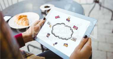 Digital composite image of woman holding tablet PC with cloud icon on screen
