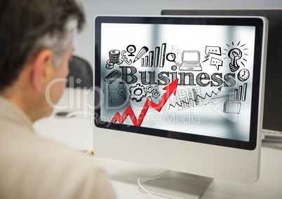 Man at computer showing red arrow with black business doodles against blurry background