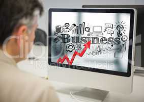 Man at computer showing red arrow with black business doodles against blurry background
