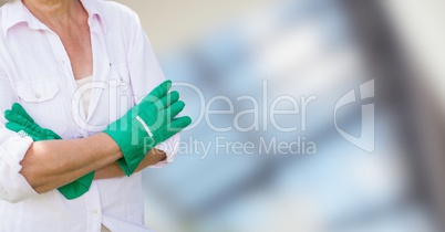 Gardener with her hands folded on blurred background