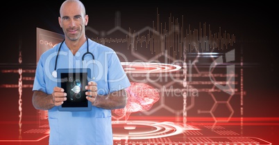 Digitally generated image of male doctor showing digital tablet against tech graphics