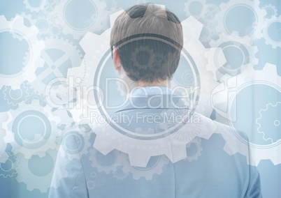 Back of business man with gear graphic overlay