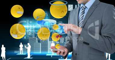 Digital composite image of businessman using smart phone with various emojis