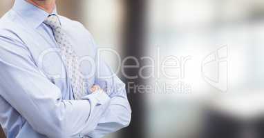 business man in his office with his hands folded. Blurred back