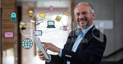 Digitally generated image of various icons with businessman using digital tablet in office