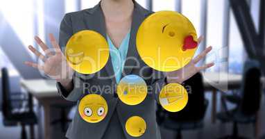 Midsection of businesswoman with emojis