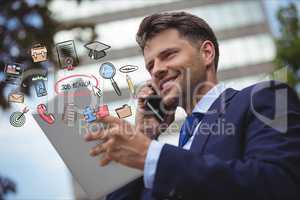 Happy businessman using smart phone and digital tablet with various job search icons