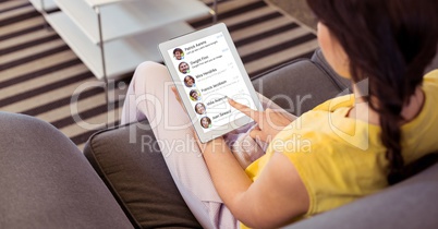 Woman social networking on digital tablet