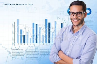 Digital composite image of businessman with arms crossed over graphs