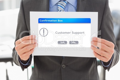 Midsection of businessman holding confirmation box