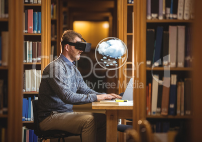 Man wearing VR Virtual Reality Headset with Interface and laptop