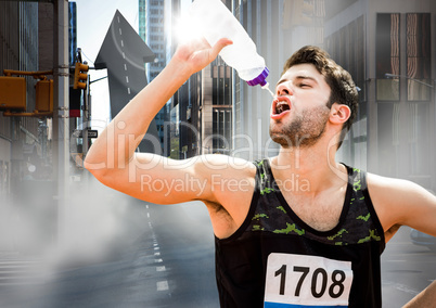 Male runner drinking on arrow shaped road on street