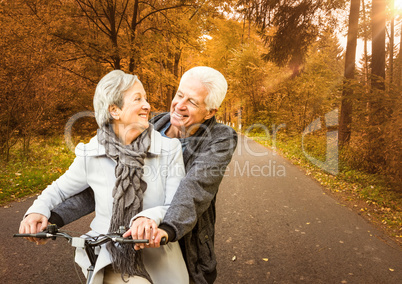 Couple with bike in the forest
