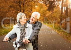 Couple with bike in the forest