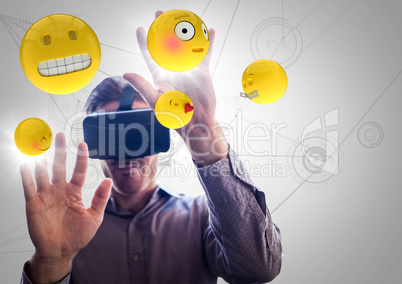 Man in VR with hands up touching flares and emojis against white network