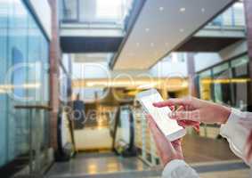 women hands with phone in shopping centre