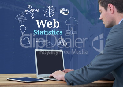 Businessman on laptop with Web statistics text with drawings graphics