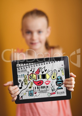 Kid against yellow wall holding tablet showing music doodles on sketchbook