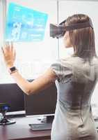 Woman in office wearing VR Virtual Reality Headset with Interface