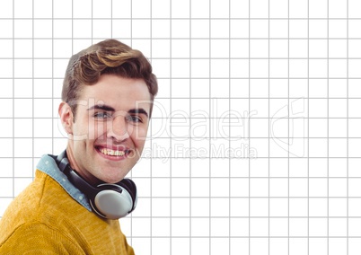 Happy man with headphones on grid background