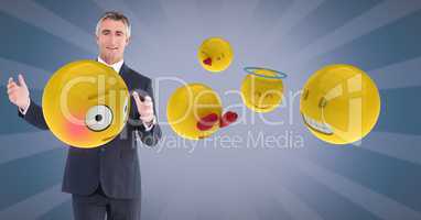 Digital composite image of businessman with emojis