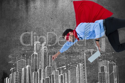 Digital composite image of businessman in super hero holding laptop while flying over buildings