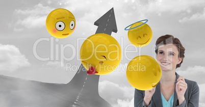Digital composite image of business woman with transparent screen and emojis by arrow