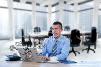 Digital composite image of businessman using laptop with web design icons in foreground