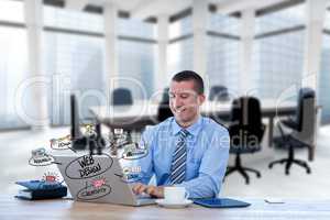 Digital composite image of businessman using laptop with web design icons in foreground