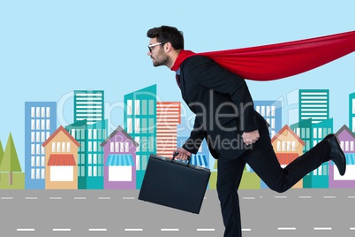 Digital composite image of businessman in super hero costume running in city