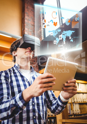 Man wearing VR Virtual Reality Headset with Interface and tablet