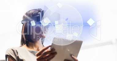 Business woman using tablet PC and VR glasses over bright background