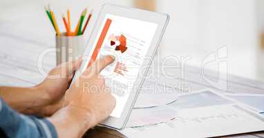 Businessman analyzing plan on tablet PC