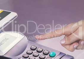 Hand touching card reader with purple background