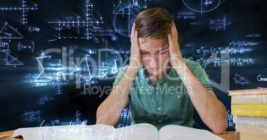 Digital composite image of tensed male student against blackboard with equations
