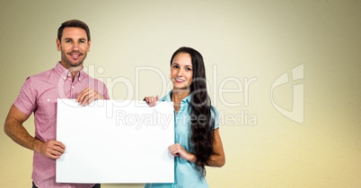 Smiling couple holding blank billboard