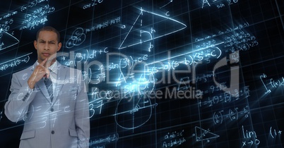 Digital composite image of businessman over math equation background