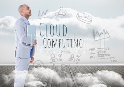 Man with laptop and Cloud Computing text with drawings graphics