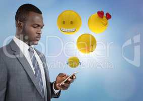 Business man on phone with emojis and flare against blue background