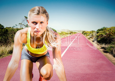Woman runner on track in desert