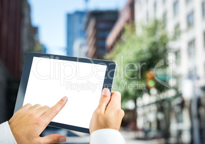 Hands with tablet in the city