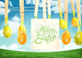 Happy Easter text with Easter Eggs with note on pegs in front of pattern