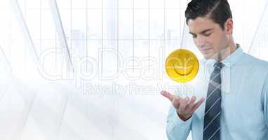 Business man with hand open and emoji with flare against white window