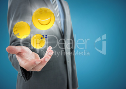 Business man mid section with hand out and emojis with flares against blue background