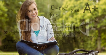Digitally generated image of formulas with female college student in background