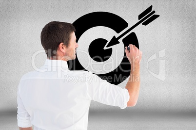 Digitally generated image of man drawing target icon against gray background