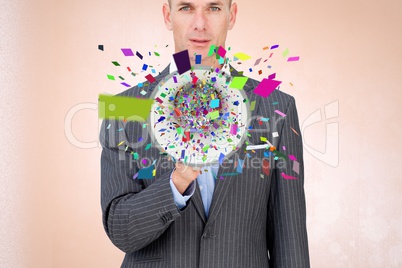 Businessman with confetti emerging from megaphone