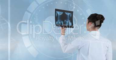 Doctor (women) looking a x-ray photography