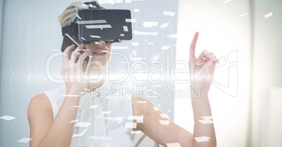 Digital composite image of businesswoman with VR glasses and smart phone