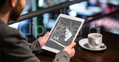 Businessman analyzing graphs on digital tablet at table